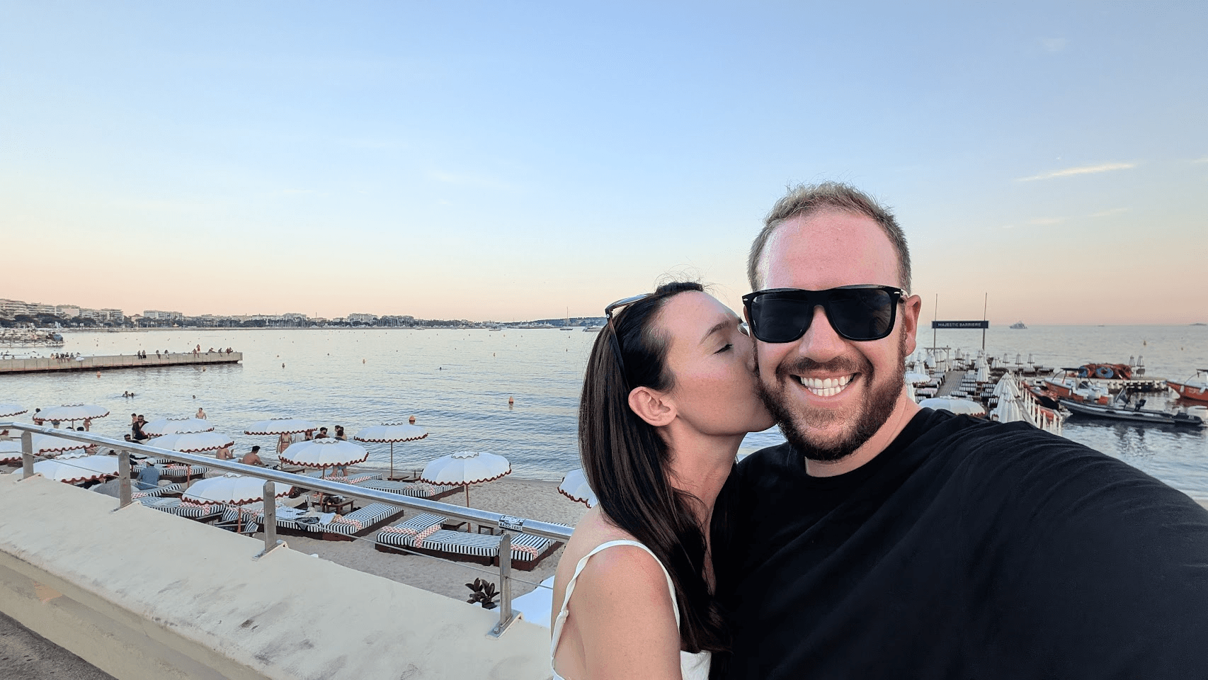 Matthew and Kiki on the beachfront in Cannes at golden hour